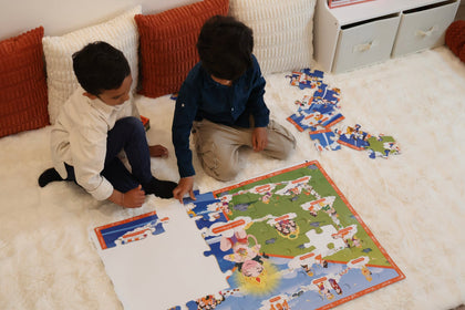 Children building the giant Ramayana floor puzzle together